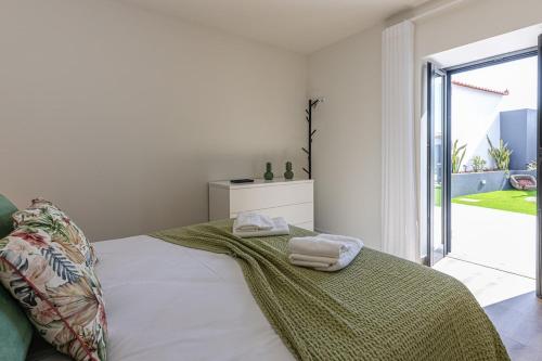 Ένα ή περισσότερα κρεβάτια σε δωμάτιο στο Vila Sun House B