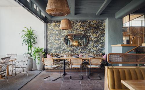 a dining room with a table and chairs at The Scott Resort & Spa in Scottsdale