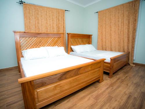 Ένα ή περισσότερα κρεβάτια σε δωμάτιο στο karibucottage&safari