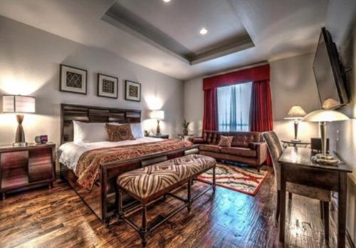 a bedroom with a bed and a desk and a couch at Sundance Club Resort in Gordon