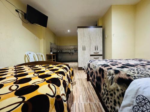 En eller flere senge i et værelse på Casa de huéspedes