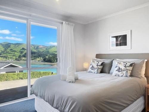 Ένα ή περισσότερα κρεβάτια σε δωμάτιο στο Harbour View 3-Bedroom Retreat