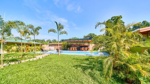 an exterior view of a resort with a swimming pool at Villas Ande in Puerto Viejo