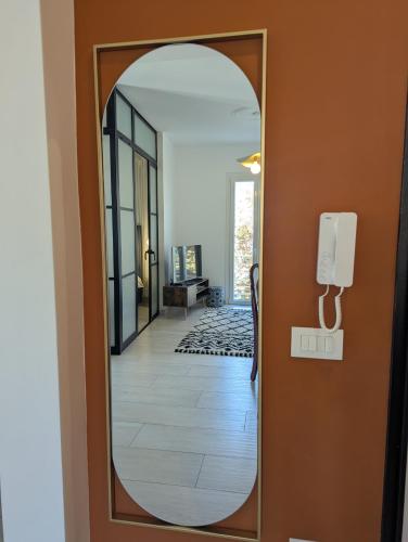 a mirror in a hallway with a hallway at Casa Moret in Sanremo