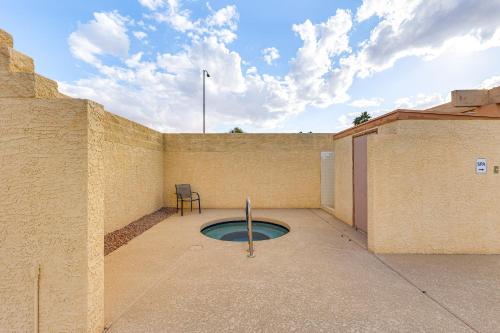 a building with a small pool on the side of it at Near Lakes and Trails Mesa Home with Golf Course View in Mesa