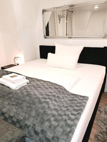 Ένα ή περισσότερα κρεβάτια σε δωμάτιο στο Enjoy Dresden Appartement