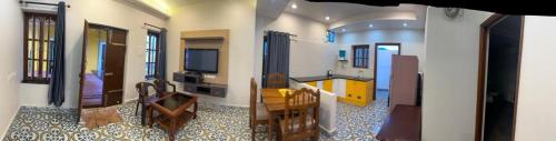 a view of a living room with a television at Serene Villa in Puducherry