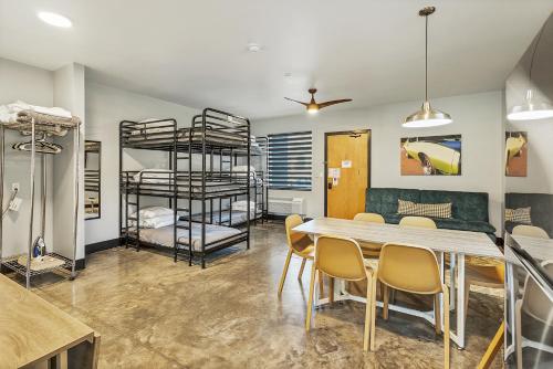 a dining room with bunk beds and a table and chairs at Large Flexible Family Suite With Private Rooms in Pacific