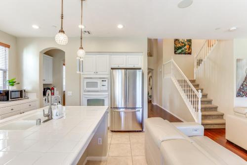 a kitchen with white cabinets and a white counter top at 14 Mi to Old Town Temecula Luxe Fallbrook Home! in Fallbrook