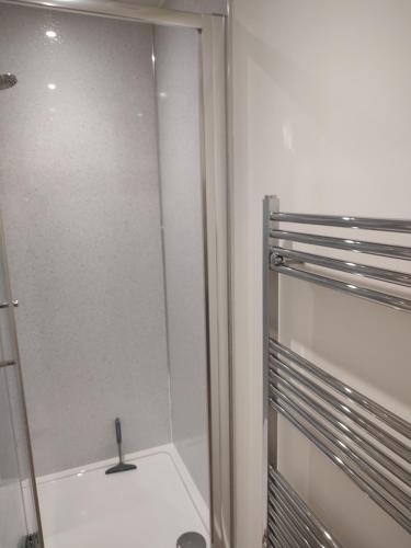 a shower stall in a bathroom with a sink at Luxury cosy house in Sanquhar