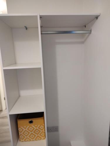 a white closet with a box in it at Luxury cosy house in Sanquhar