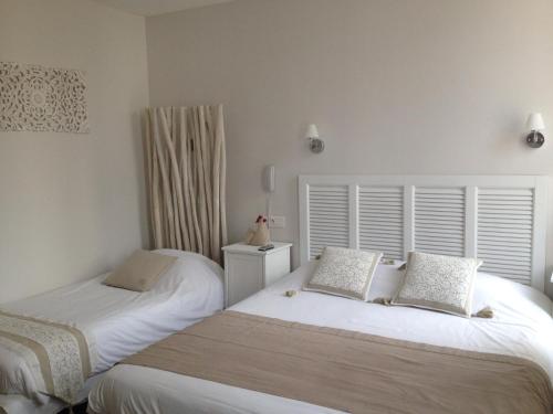 Кровать или кровати в номере Grand Hôtel des Bains SPA