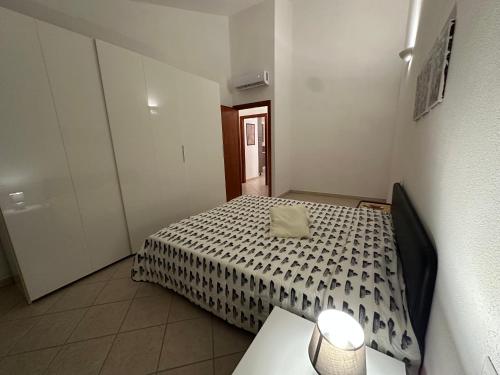 a small bedroom with a bed and a table at Casa Amabile in Sanluri