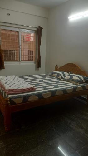 Ένα ή περισσότερα κρεβάτια σε δωμάτιο στο Ram Residency