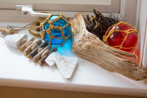 a group of items on a table with a piece of wood at Swanage Haven Boutique Guest House in Swanage