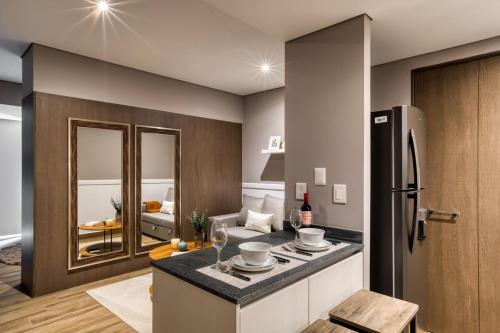 a kitchen with a counter top and a refrigerator at Resort Home with Extraordinary City View in Mexico City