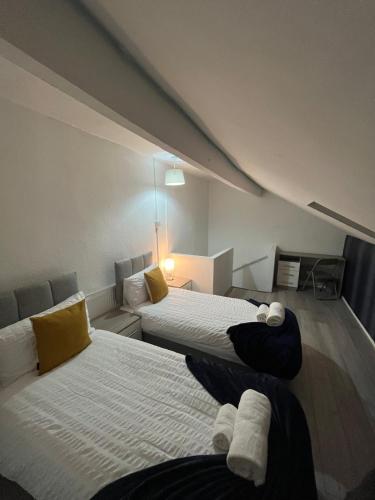 Ένα ή περισσότερα κρεβάτια σε δωμάτιο στο Leeds Getaway 1#