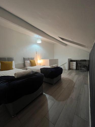 Ένα ή περισσότερα κρεβάτια σε δωμάτιο στο Leeds Getaway 1#