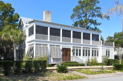 an older white house with large windows at Montage Palmetto Bluff in Bluffton