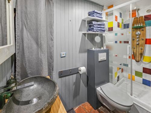 a bathroom with a sink and a toilet at Ancienne dépendance du Duc de Normandie - Château in Caen
