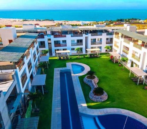 an aerial view of a resort with a swimming pool at Condomínio Boas Vistas in Aracati