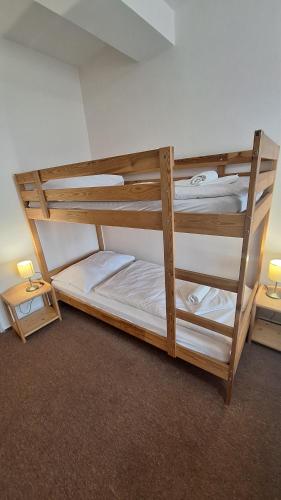 two bunk beds sitting in a room with at Pension Valja in Janske Lazne