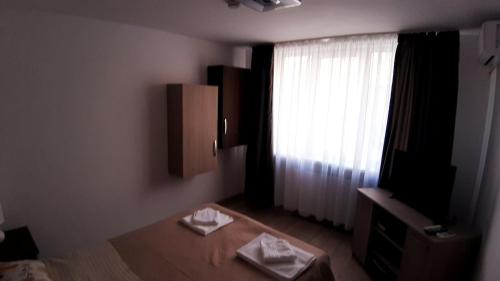 Postel nebo postele na pokoji v ubytování Acasa in Piatra Neamt