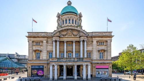 a building with a clock tower on top of it at NEW! Amazing Studio Apartment Sleeps 3 Hull Central in Hull