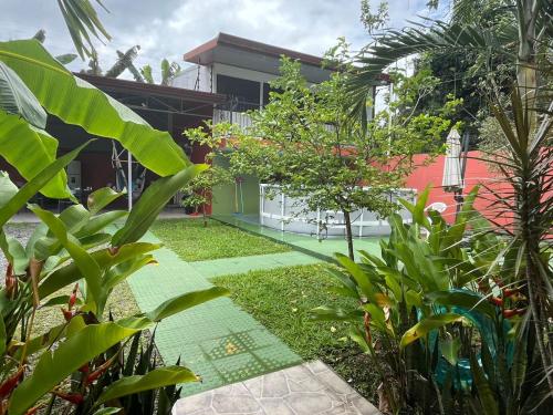 a view of a house from the garden at Villa tico House in Cariari
