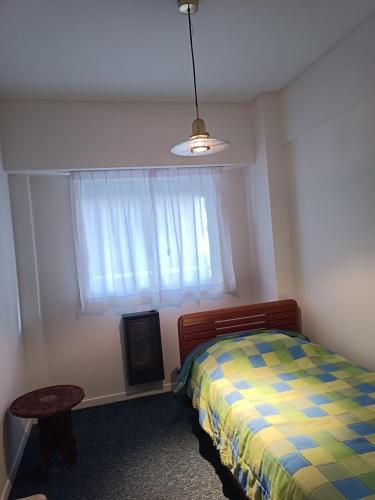 a bedroom with a bed and a window at Nice apartment in good location in Buenos Aires
