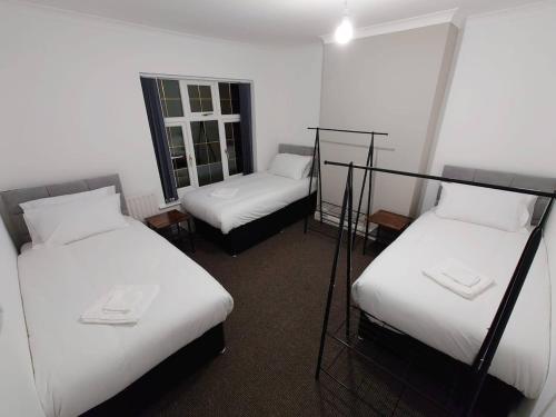 Cama o camas de una habitación en C Spacious 5 Bed - Pkg WiFi Long Stays
