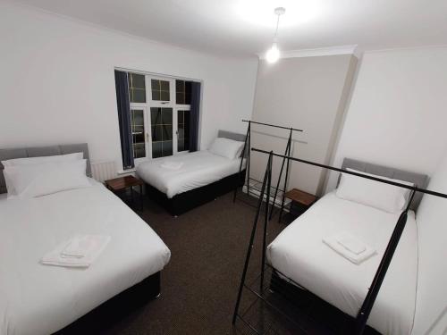 Cama o camas de una habitación en C Spacious 5 Bed - Pkg WiFi Long Stays