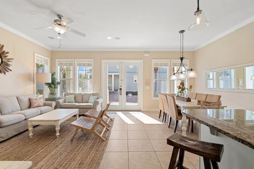 a living room with a couch and a table at Seeking Sunsets 30A in Rosemary Beach