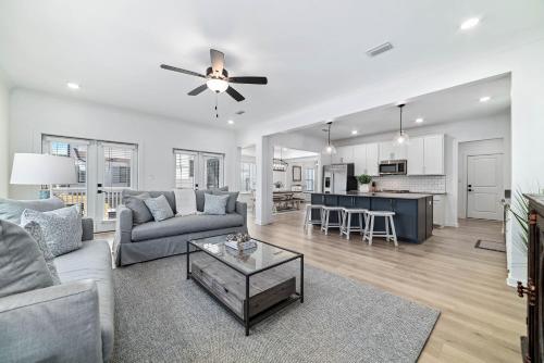 a living room with a couch and a table at Endless Summer in Orange Beach