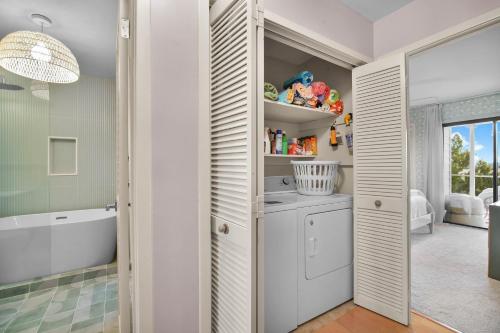 a bathroom with a sink and a bath tub at Charming Newly Renovated 3-Bedroom Home on Nautical Watch in Nautical Watch Villas