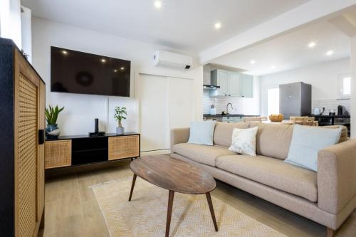 a living room with a couch and a table at CASA Castelejo in Vila do Bispo