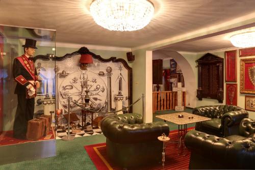 a room filled with furniture and a large clock at Pension Masonic House in Loket