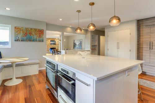 a kitchen with a white counter top and an island at Outdoor Adventurers Oasis in White Salmon in White Salmon