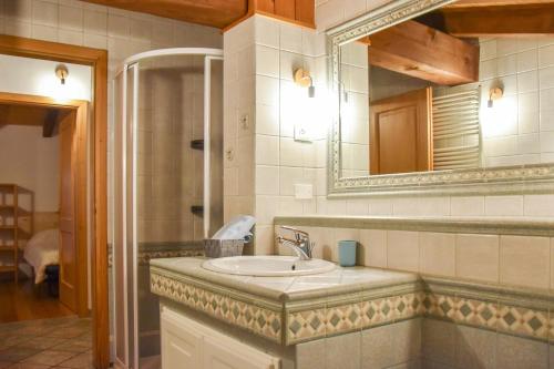 a bathroom with a sink and a mirror at Dal Carniel in Aldeno