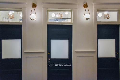 a couple of doors in a building with lights at Warner Hotel in Bisbee