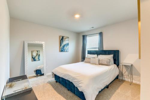 a bedroom with a large bed and a window at 17 Mi to Dtwn Nashville Family-Friendly Gem in Antioch