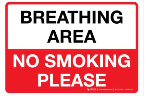 a red sign with the words breathing area no smoking please at The Loft @ Kildare Village in Kildare