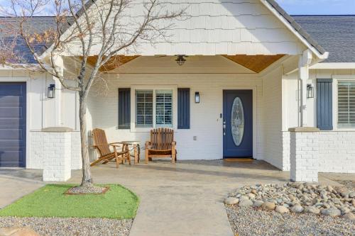 a house with a blue door and a patio at Walk Downtown Remodeled Home in Murphys with Yard! in Murphys