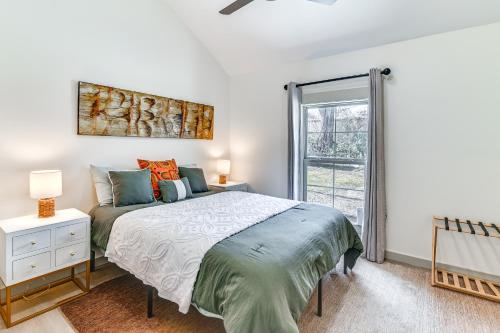 a bedroom with a bed and a window at 1 Mi to Davis Wade Stadium Walkable Paradise! in Starkville
