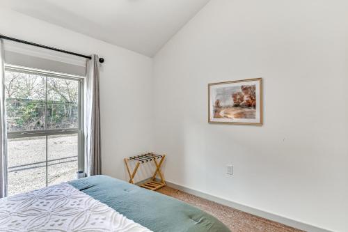 a bedroom with a bed and a window at 1 Mi to Davis Wade Stadium Walkable Paradise! in Starkville