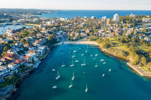 an aerial view of a river with boats at Quiet Little Manly 1 bed - 3min walk Harbour & Beaches w Level Access in Sydney
