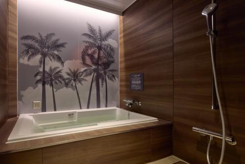 Ein Badezimmer in der Unterkunft 袖ヶ浦c COAST HIKE HOTEL