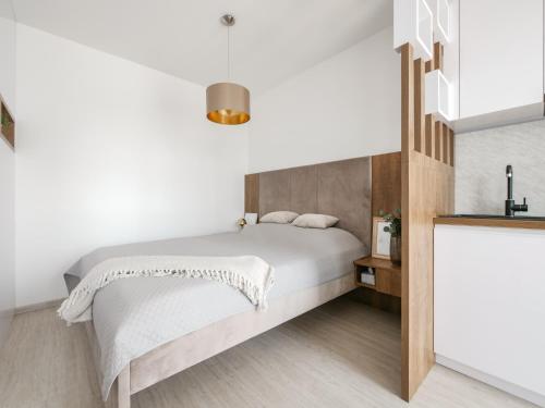 Postel nebo postele na pokoji v ubytování Modern Studio EinPark Residence