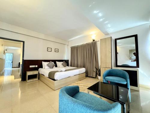 Katil atau katil-katil dalam bilik di Veu Munnar Retreat - Valley View Rooms