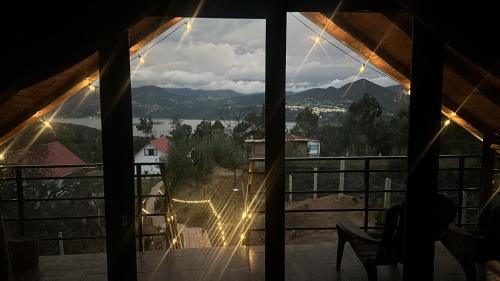 a window view of a mountain view from a house at Toscana Romántica in Guatavita